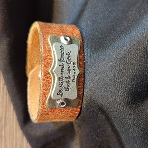 Upcycled leather cuff bracelet made from a leather belt.